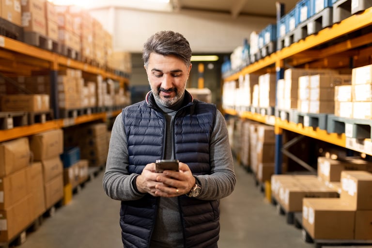 Adult man working in factory warehouse
