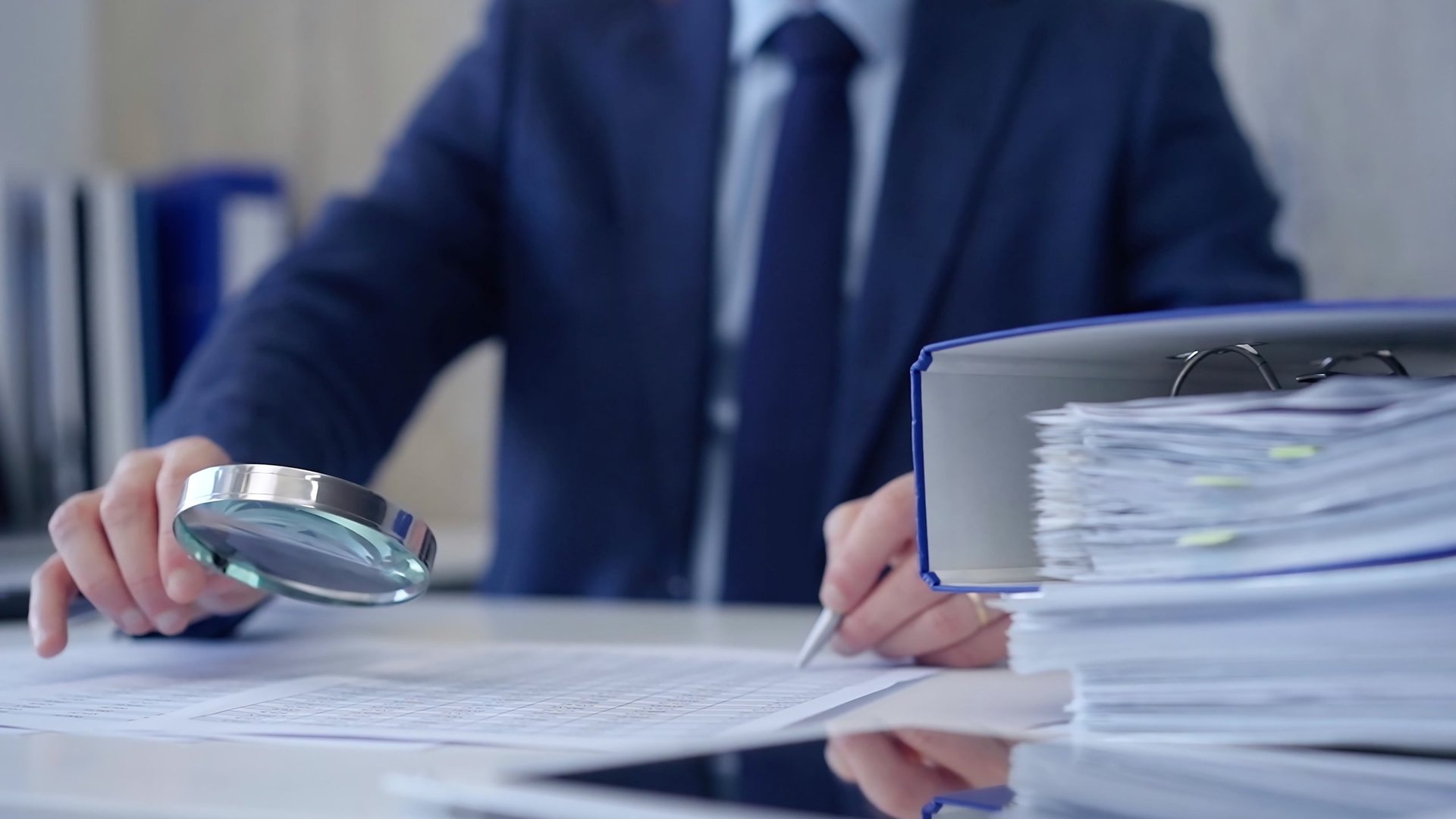 Financial audit professional examining documents for overpayment recovery and missed credits
