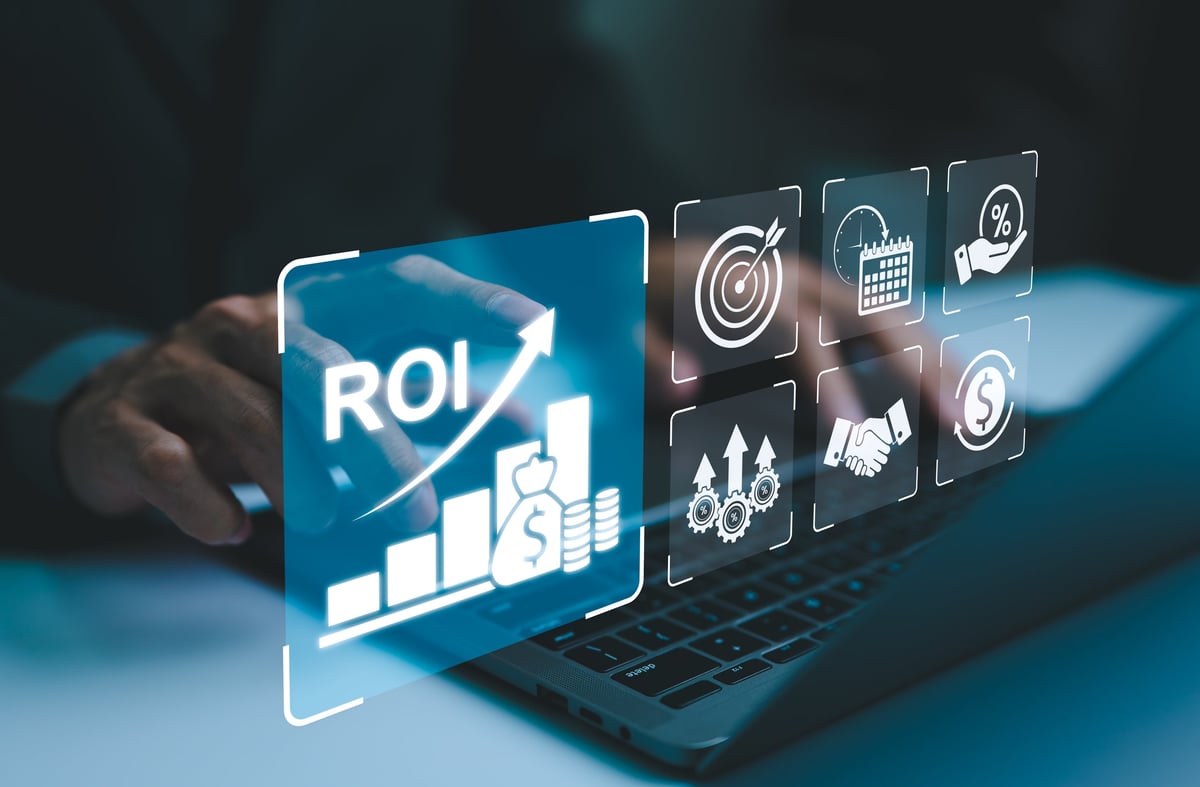 Business executive analyzing AI automation ROI and business strategy metrics on a laptop for a decision framework