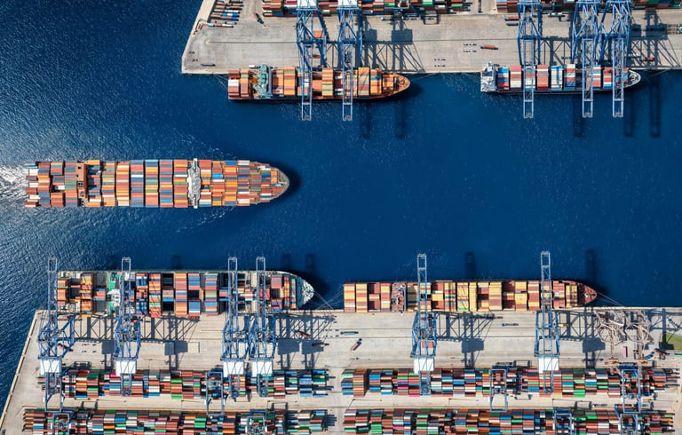 Aerial top down view of container cargo ship terminal harbor with loading activity