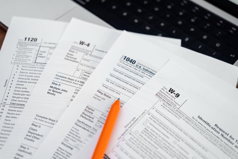 Tax forms and documents on a professional desk for WOTC and hiring incentive analysis