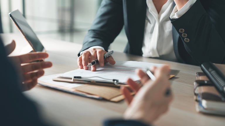 Senior financial professional examining audit documents for recovery review