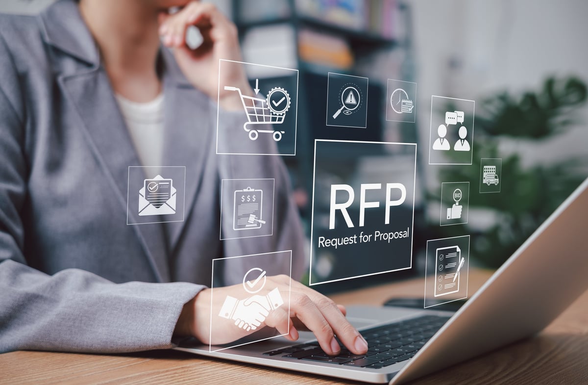 RFP, Request for Proposal. Businessperson using laptop with RFP icons