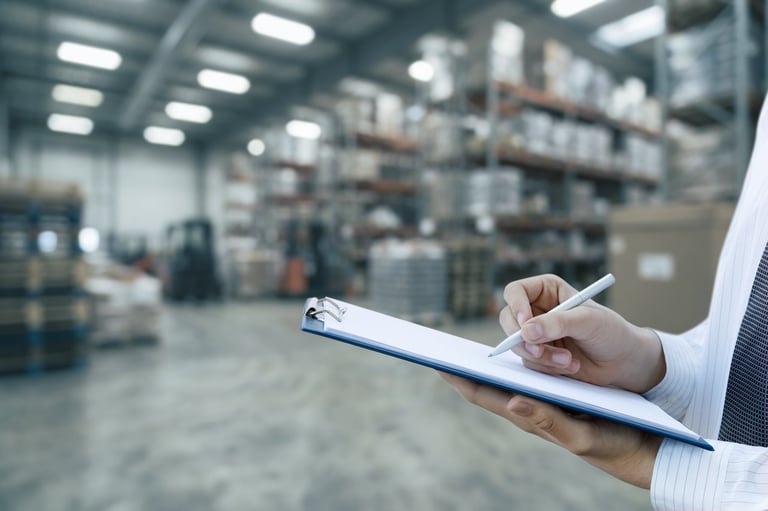 Import operations specialist reviewing duty drawback records and cargo documents
