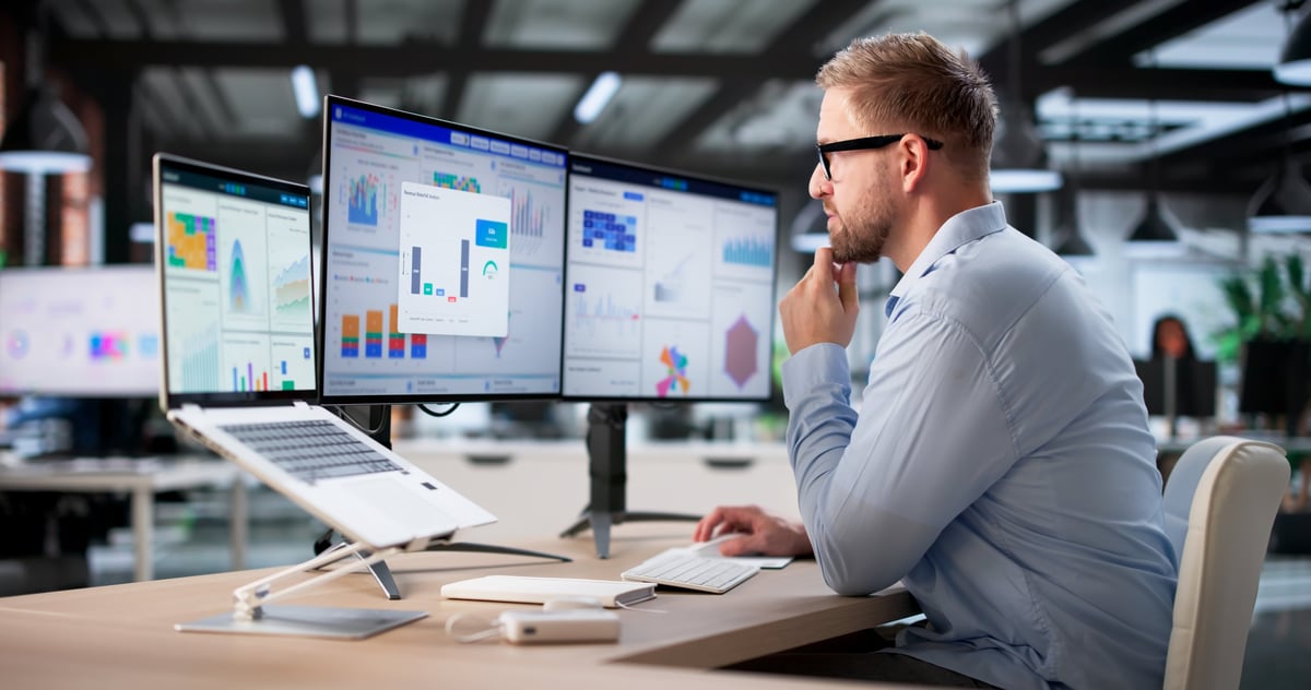 Real-time data analyst monitoring operational metrics and process automation dashboard
