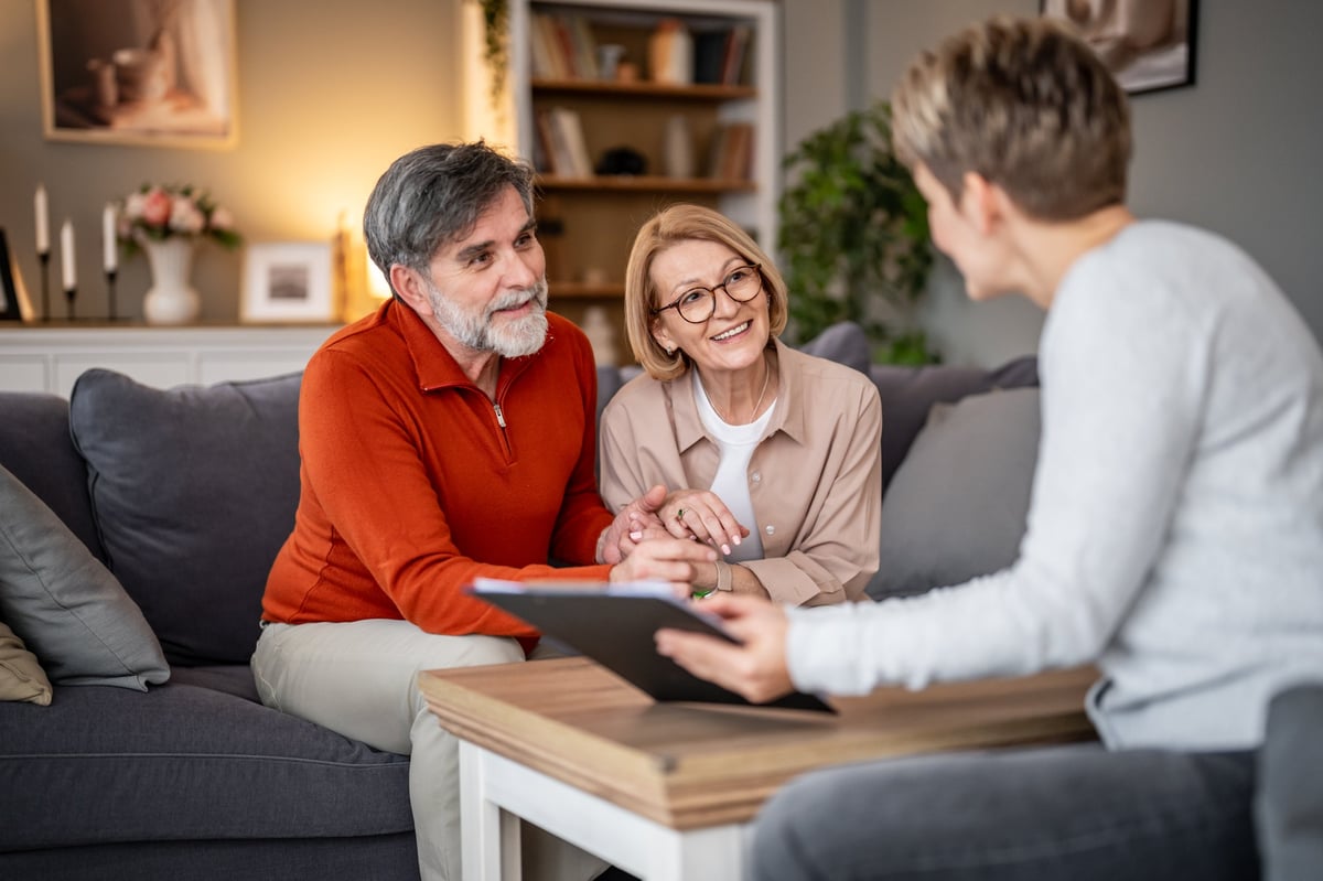 A financial advisor meeting with a business client to discuss cost-reduction opportunities and client strategy