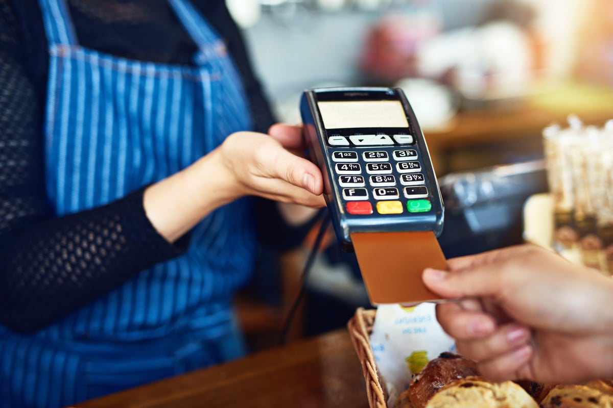 Cropped shot of an unrecognizable man paying for his purchase by card